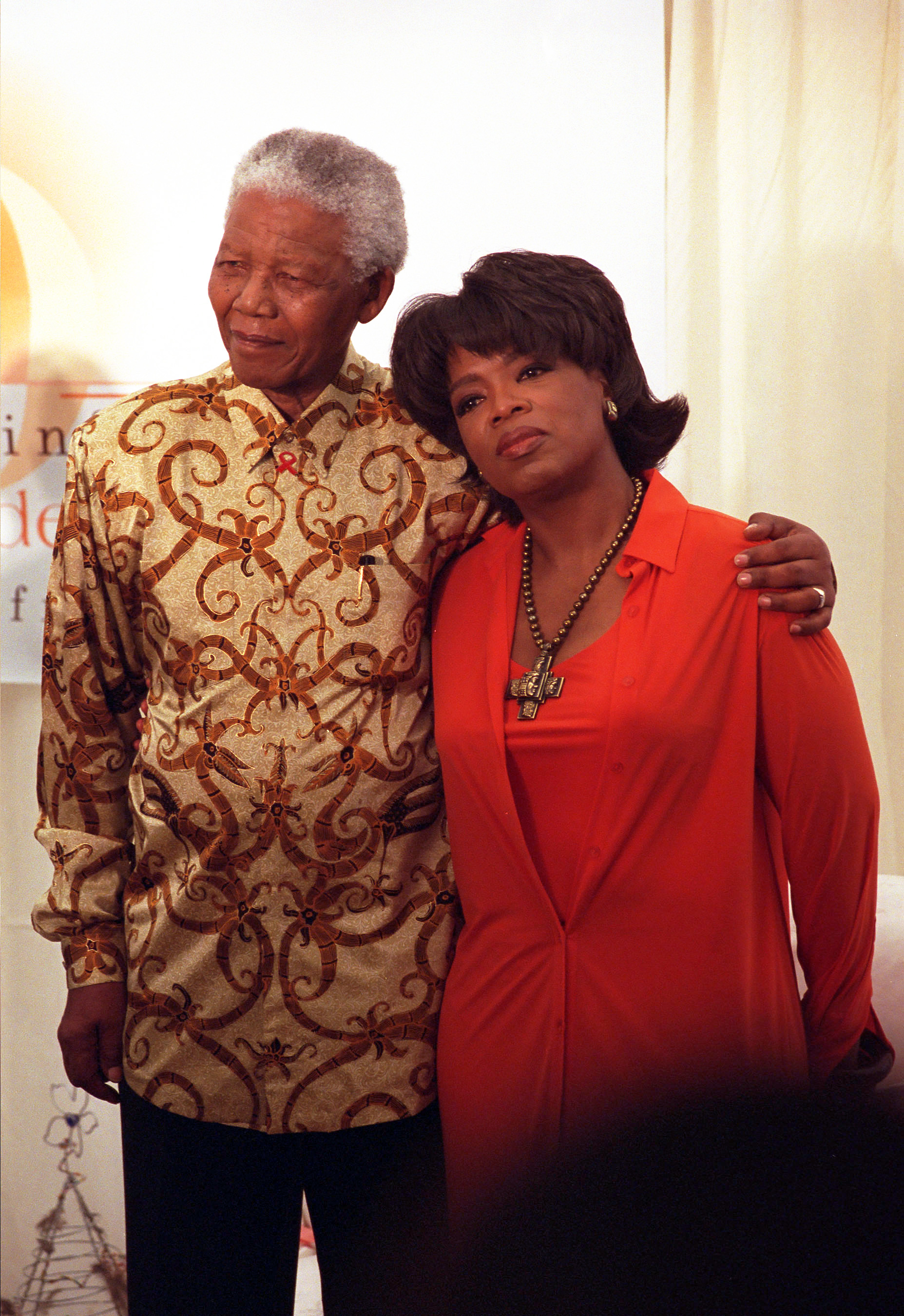 06 Dec 2002, Henley On Klip, Gauteng Province, South Africa --- Nelson Mandela places his arm around the shoulders of author and talk show host Oprah Winfrey at the launch of her $10 million Leadership Academy for Girls in South Africa. She described Mandela as her "hero" and he called her a "queen." --- Photo by Louise Gubb/Corbis Saba --- Image by © Louise Gubb/Corbis